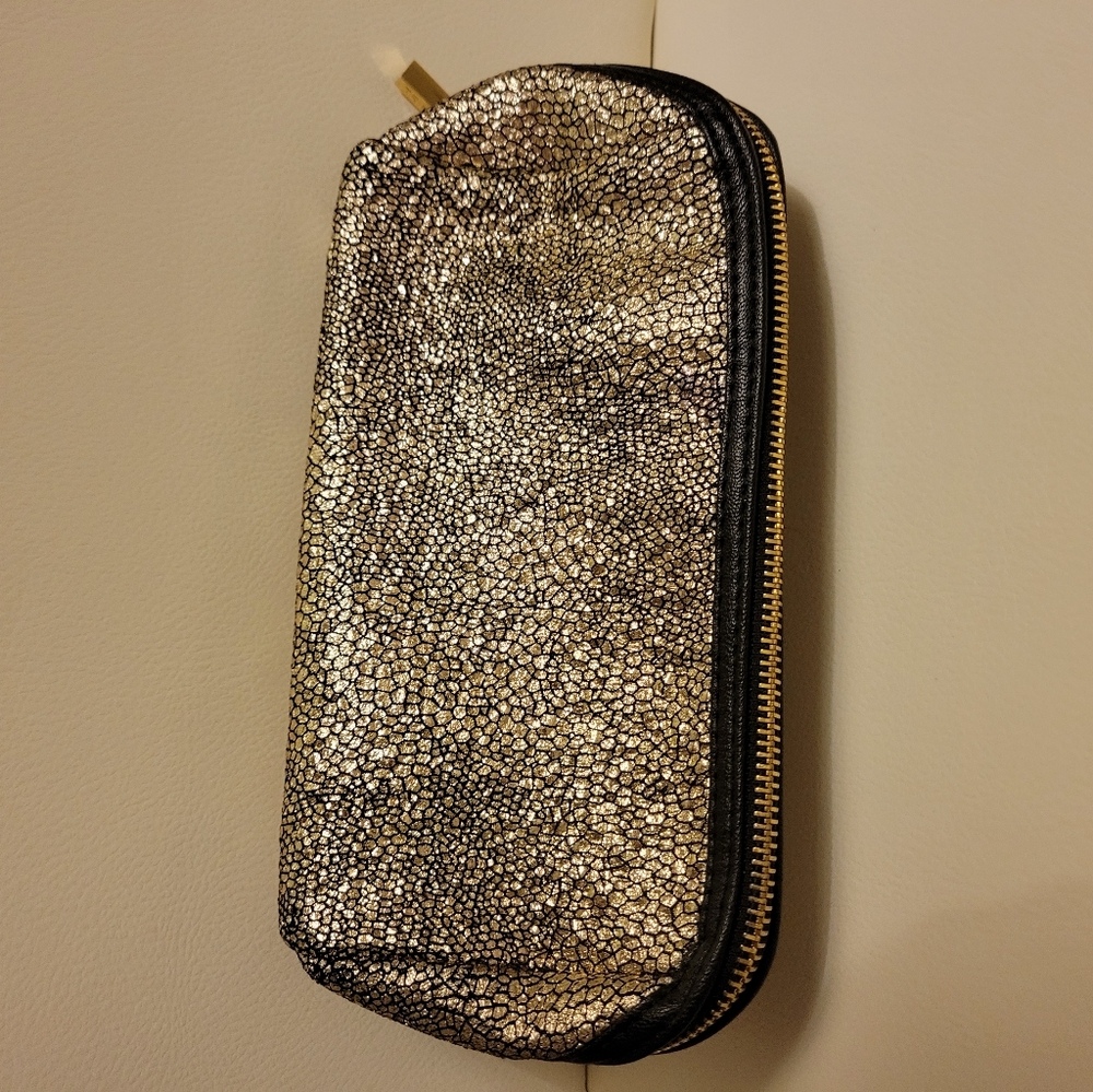 Trina make up bag gold speckle, black inside and black trim around zipper